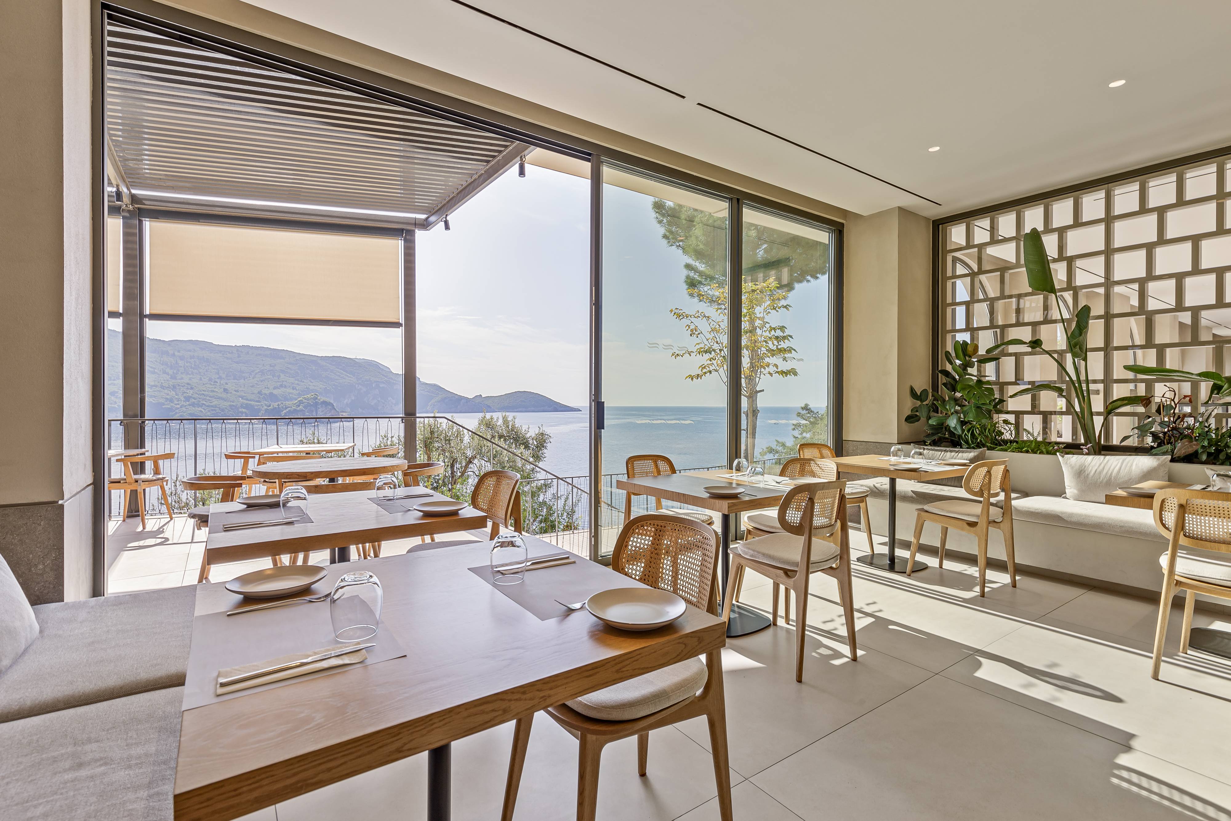 The sea-facing dining room at Akrotiri Beach Resort Hotel in Corfu