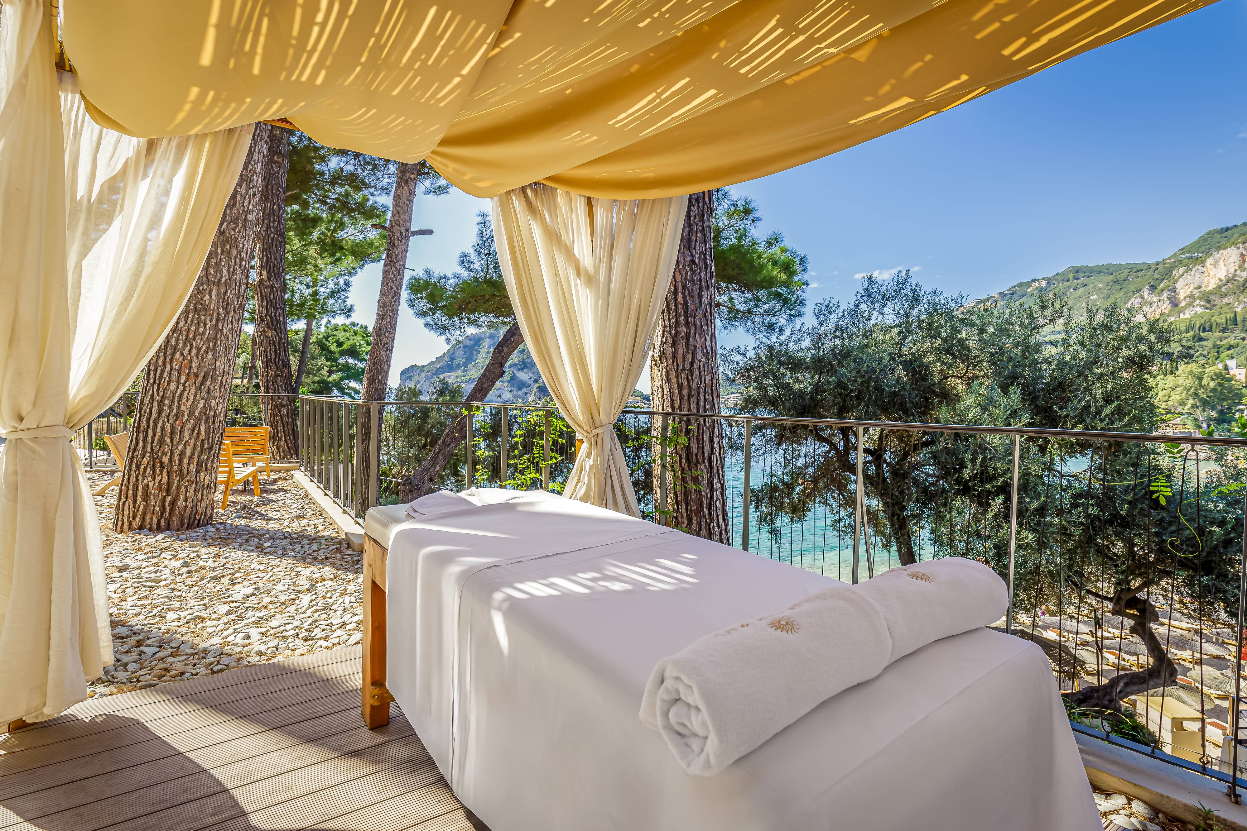 A sheltered treatment bed outdoors at Akrotiri Beach Resort Hotel in Corfu