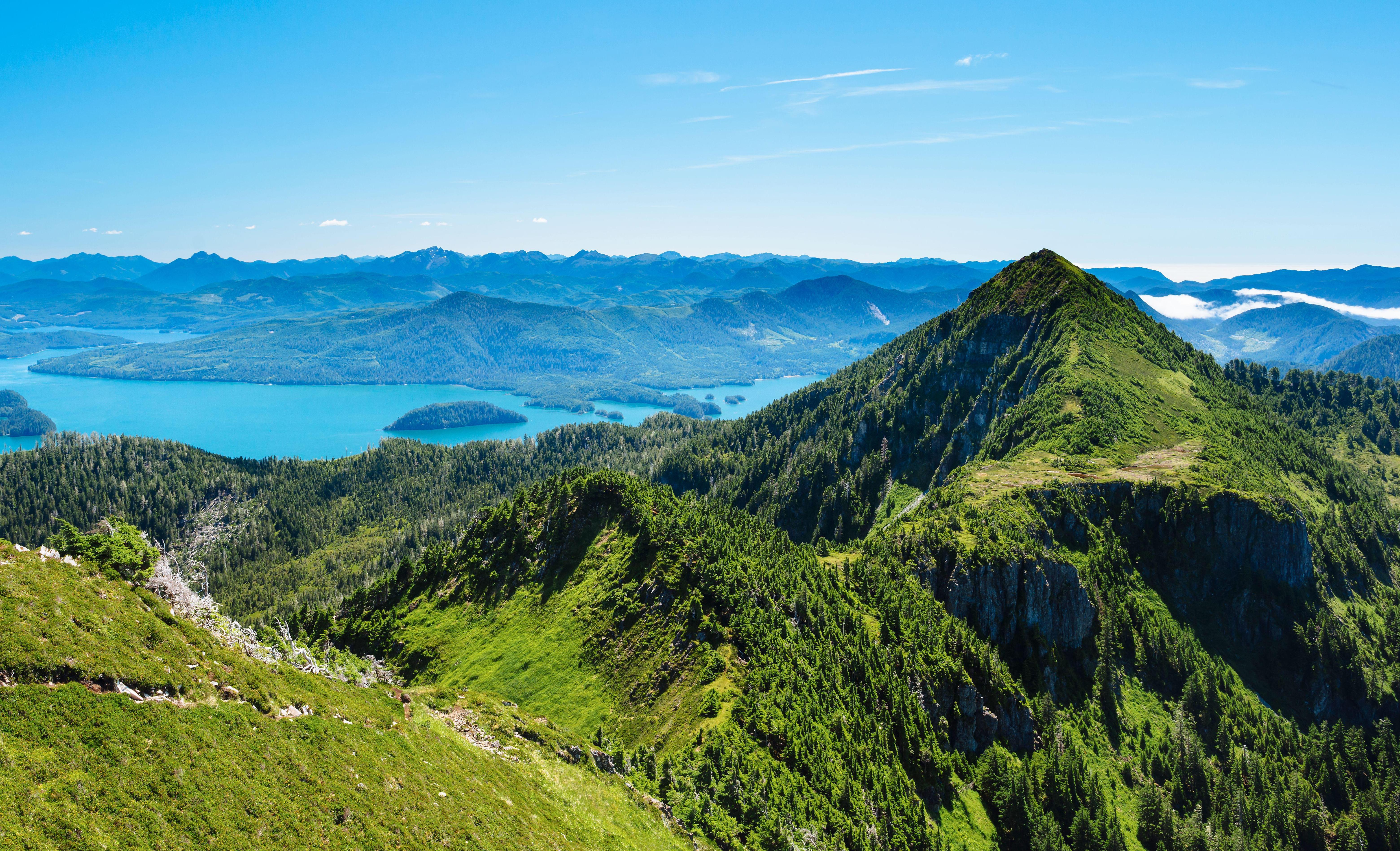 View from Sleeping Beauty Trail, Haida Gwaii, showing mountains, ocean, and islands.