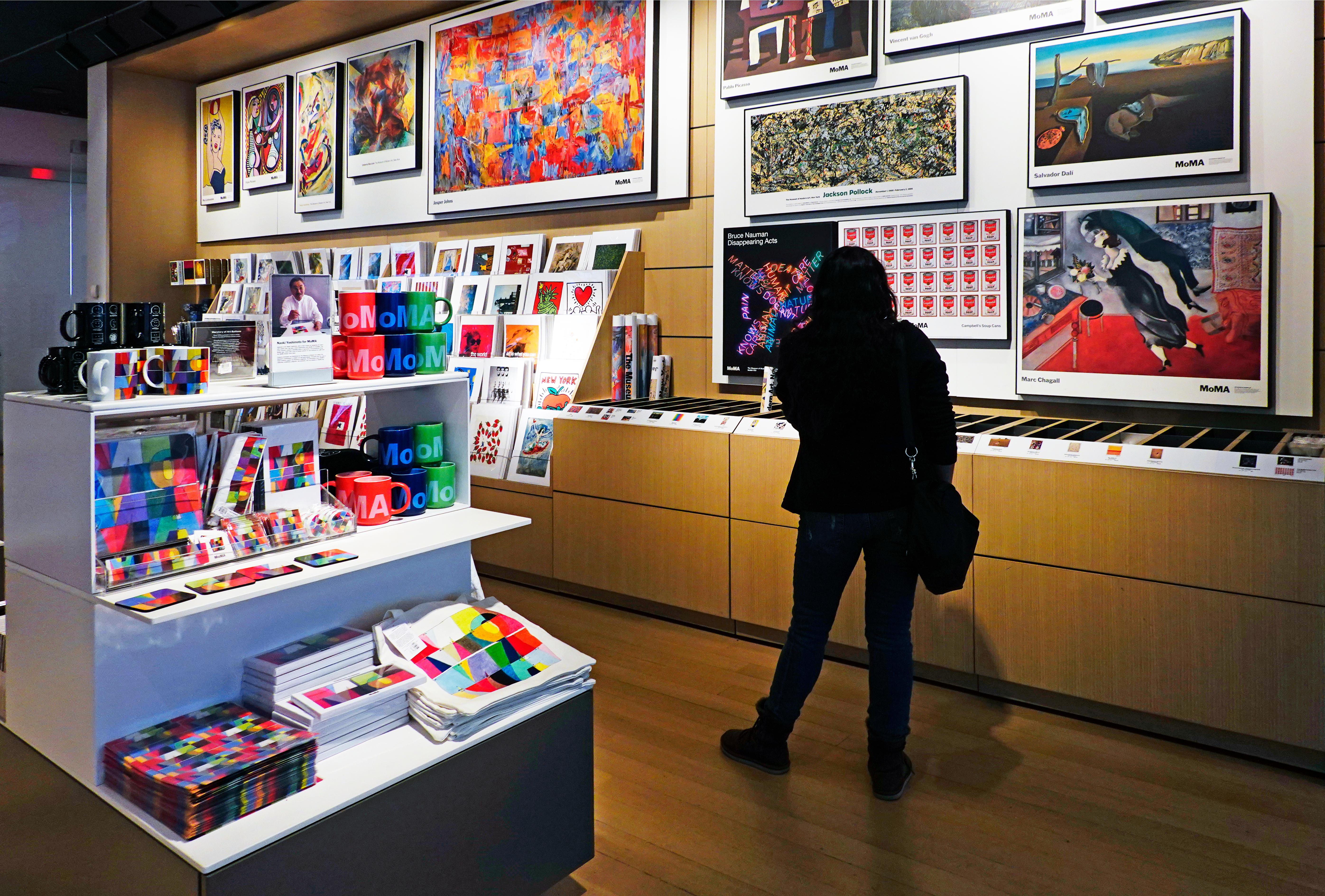 MOMA gift shop in Manhattan with merchandise and artwork.