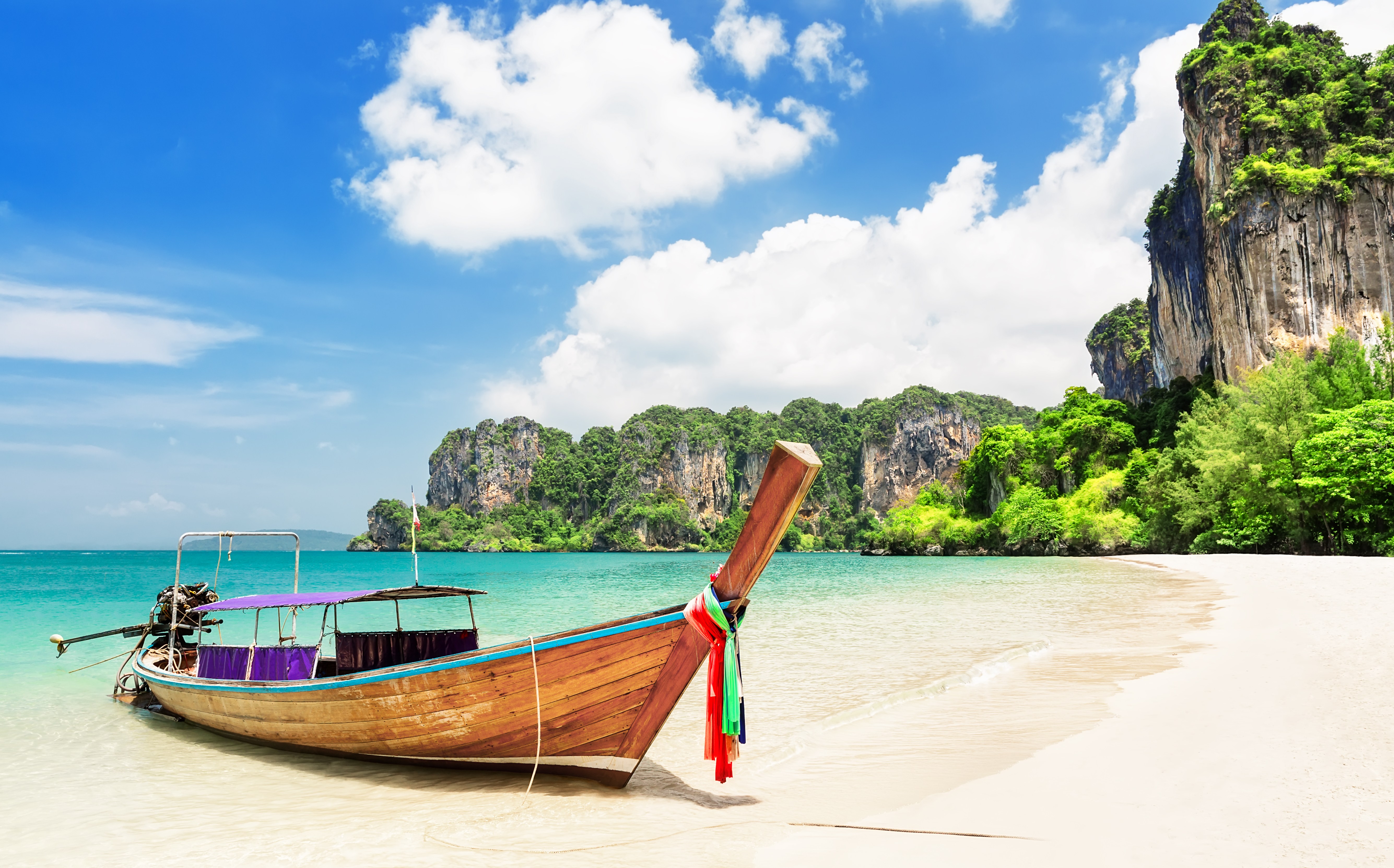 Traditional longtail boat on Railay Beach, Krabi, Thailand.