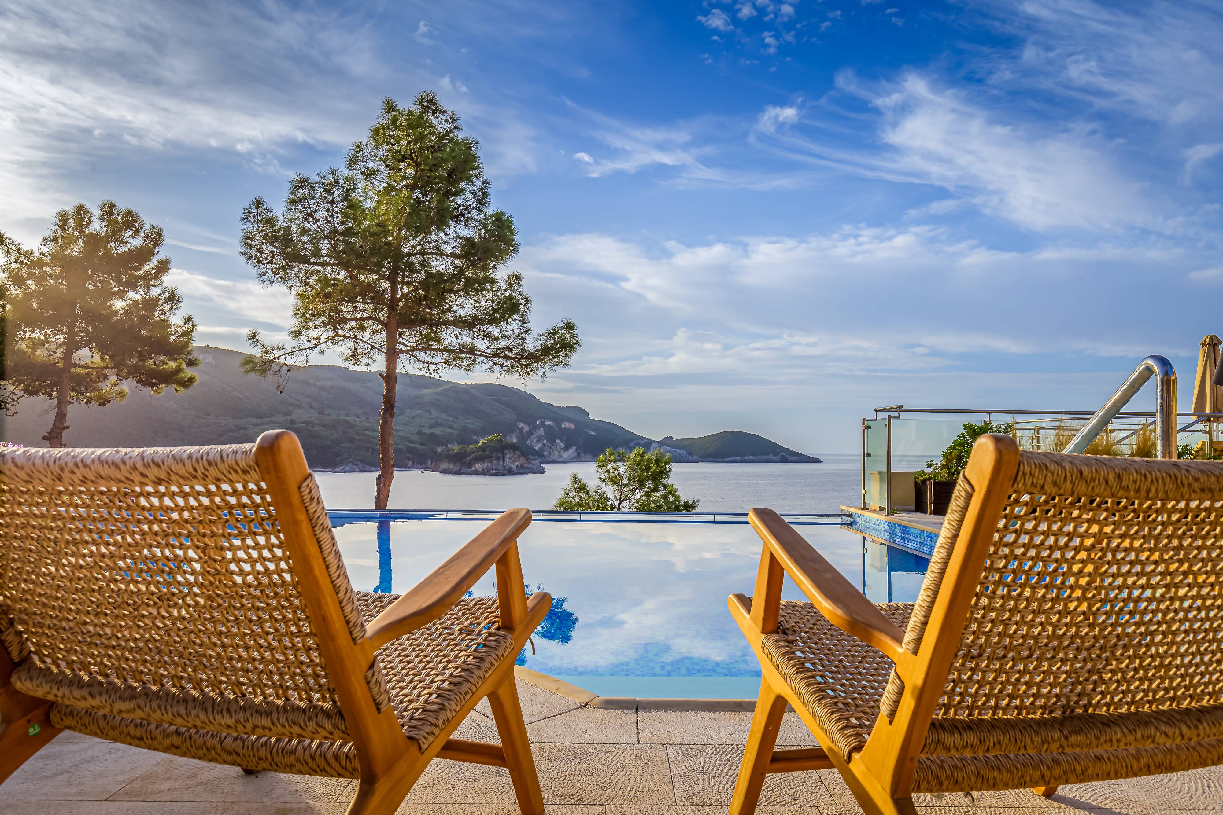 Two chairs facing the sea at Akrotiri Beach Resort Hotel in Corfu