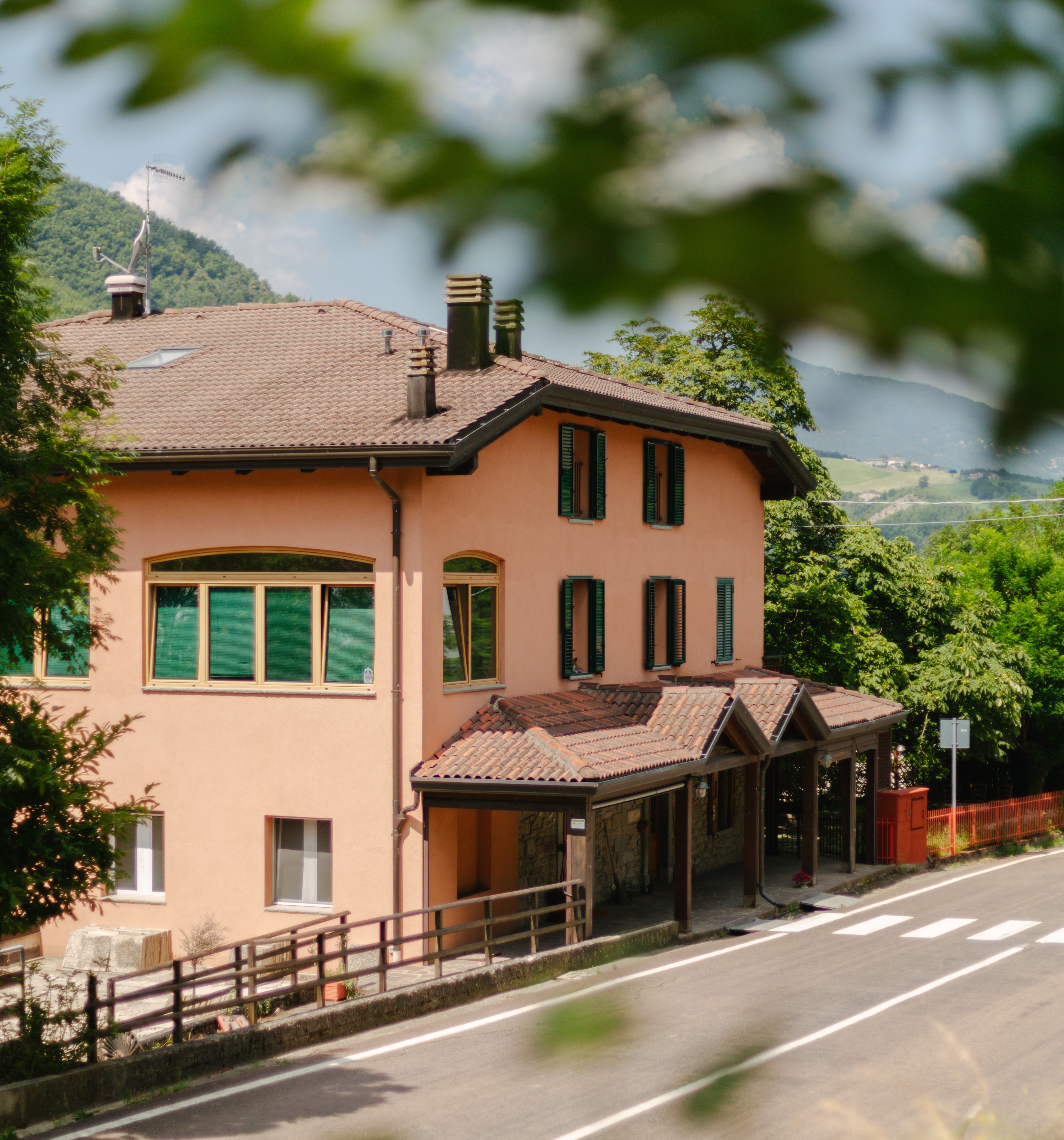 Peach-colored house near a road.